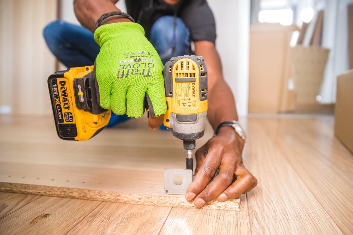 Contractor drilling into wood.